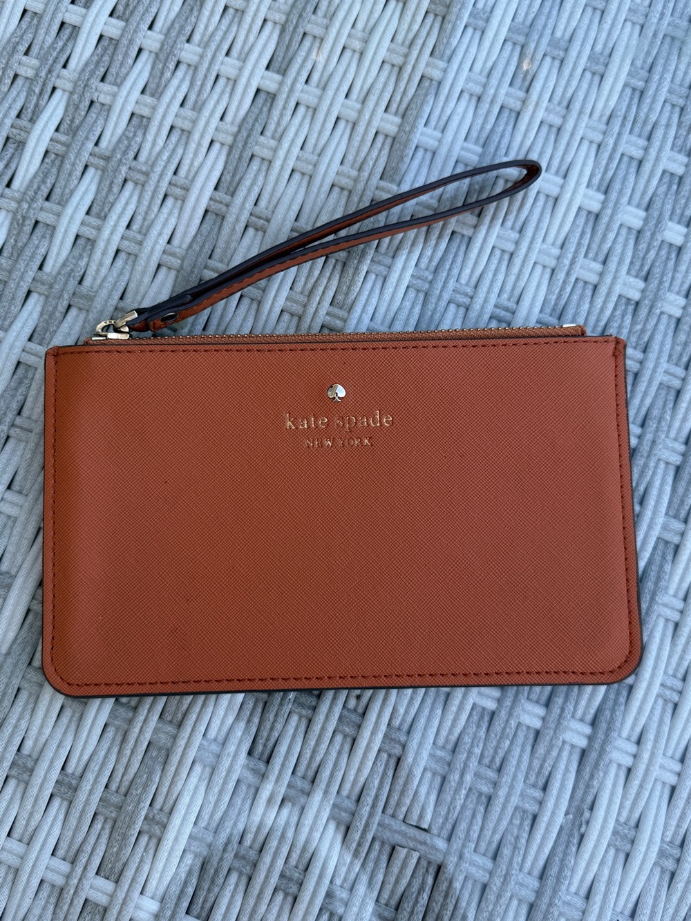 kate spade wristlet clutch in rust orange